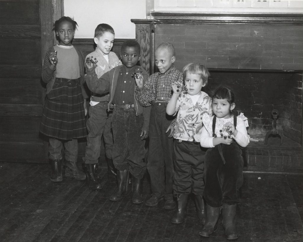 Miniature of Children standing in front of Hull-House Music School fireplace
