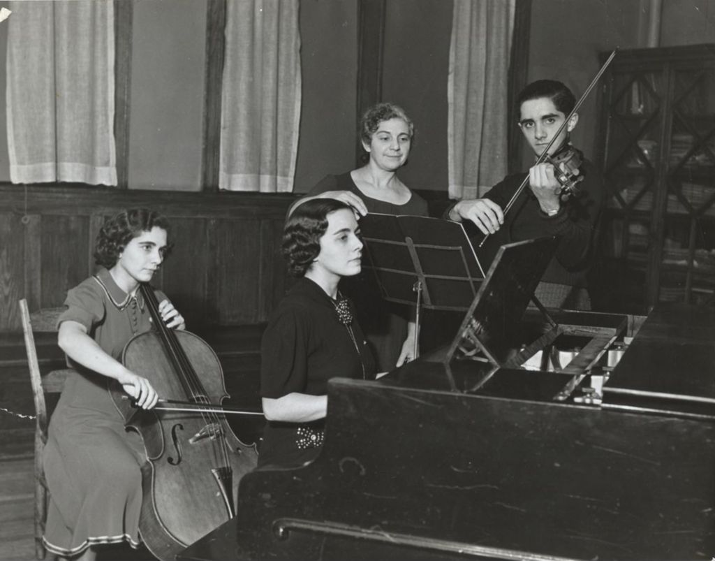 Four members of the Adezio family performing at Hull-House Music School