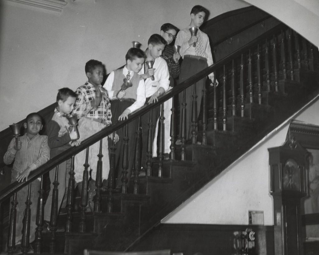 Boys on Hull-House staircase playing bells