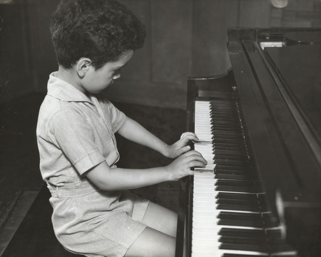 Miniature of Young boy playing piano at Hull-House Music School