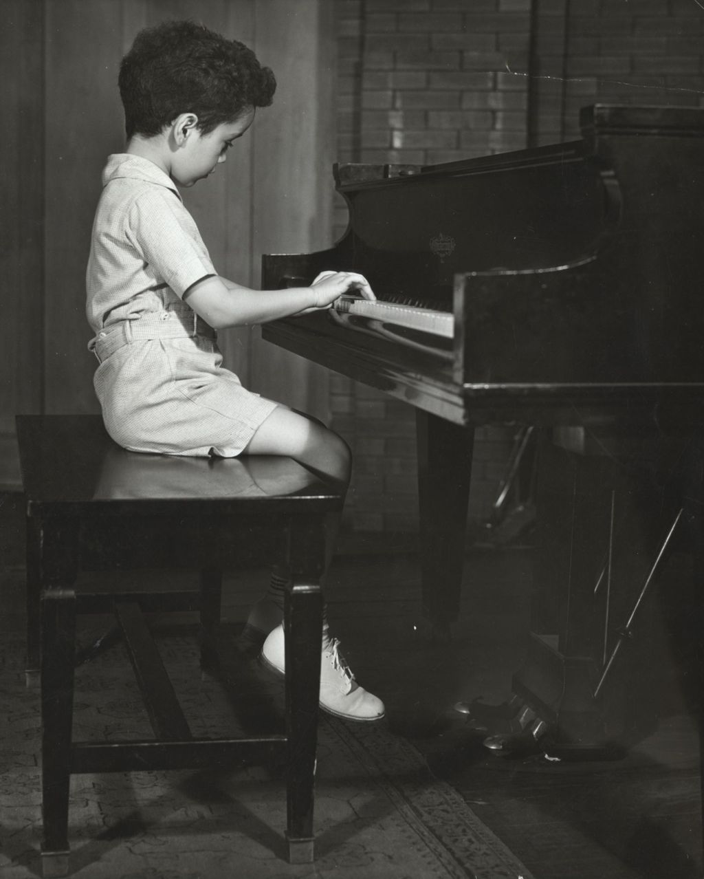 Miniature of Young boy playing piano at Hull-House Music School