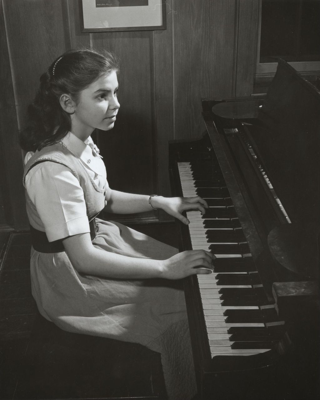 Girl practicing piano at Hull-House Music School