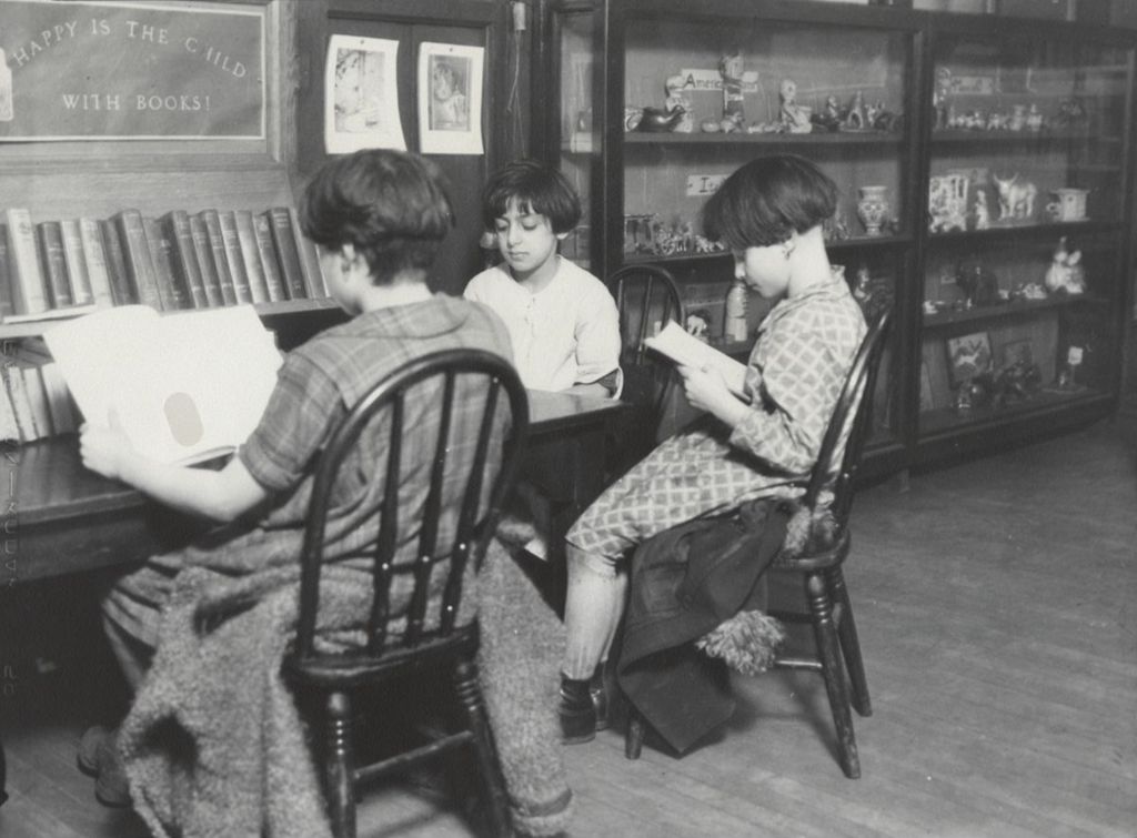 Three girls reading in Children's Reading Room