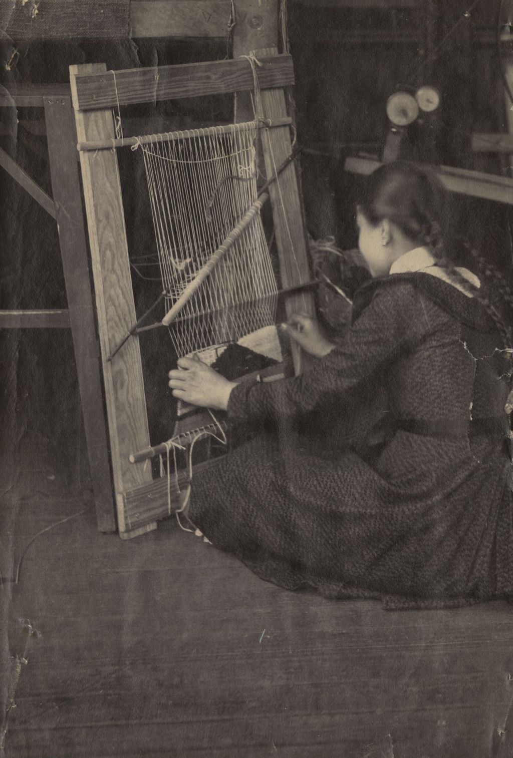Woman weaving Navajo blanket at Hull-House Labor Museum