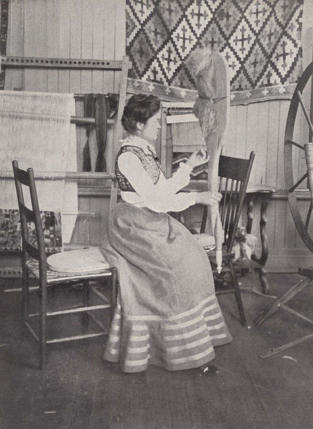Miniature of Woman hand-spinning yarn at Hull-House Labor Museum