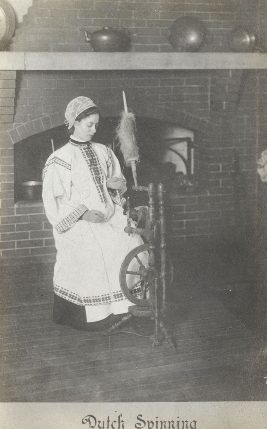 Miniature of Postcard of woman demonstrating "Dutch Spinning" at Hull-House Labor Museum