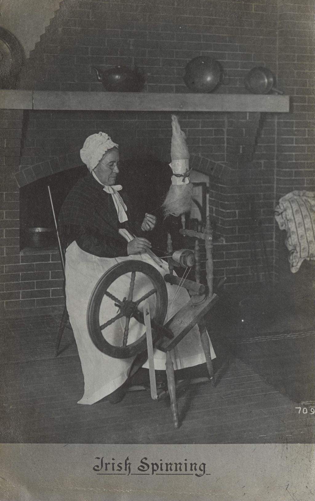 Miniature of Postcard of woman demonstrating "Irish Spinning" at Hull-House Labor Museum