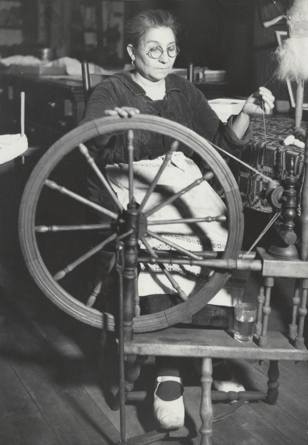 Miniature of Woman demonstrating spinning wheel at Hull-House Labor Museum
