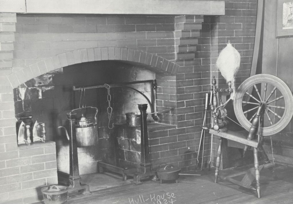 Fireplace and spinning wheel at Hull-House Labor Museum