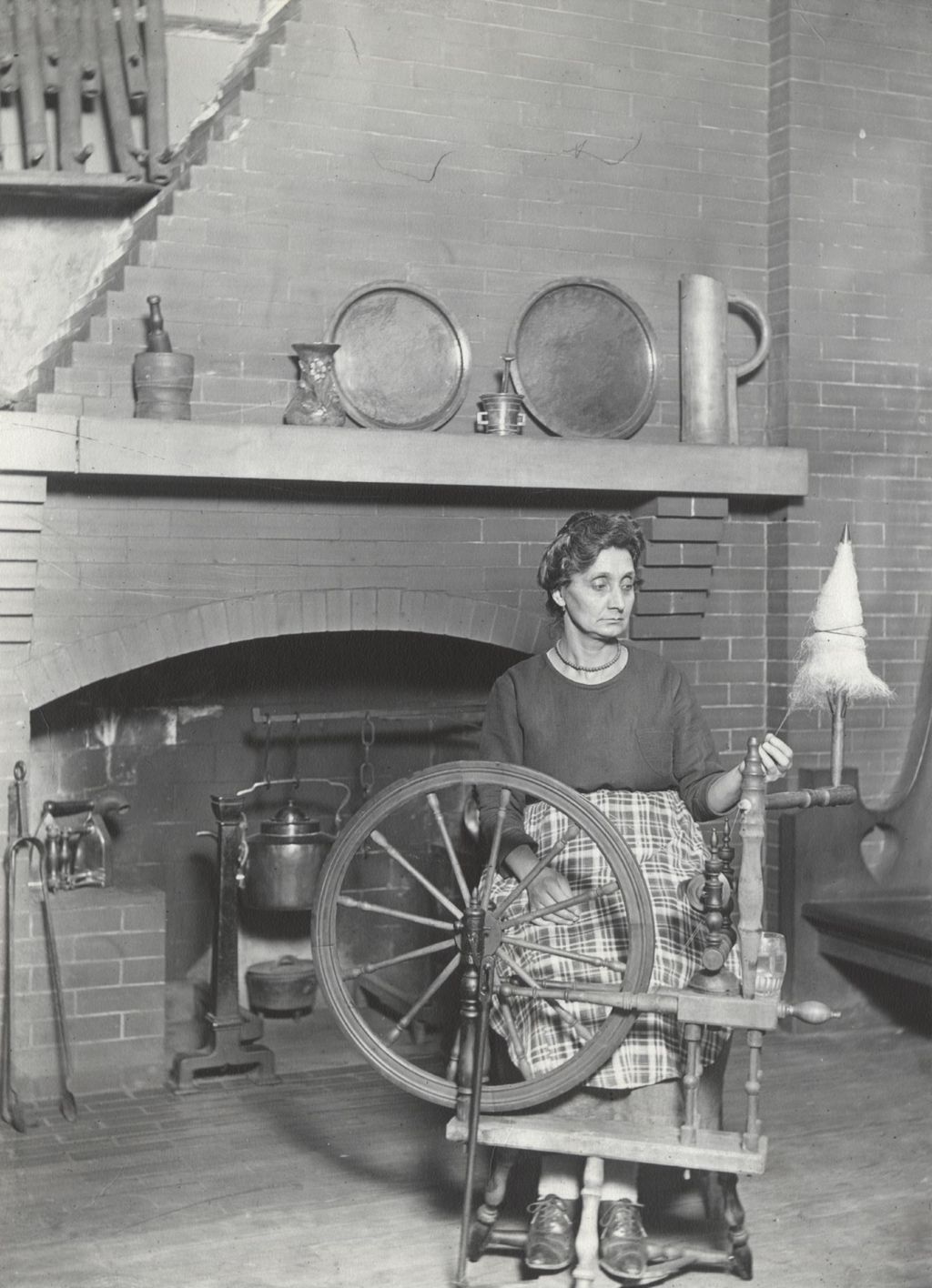 Miniature of Woman at spinning wheel in Hull-house Labor Museum