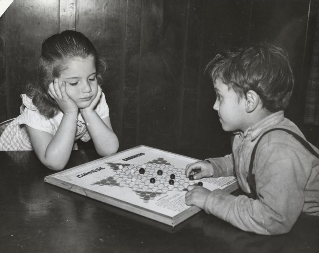 Miniature of Two children playing Chinese checkers