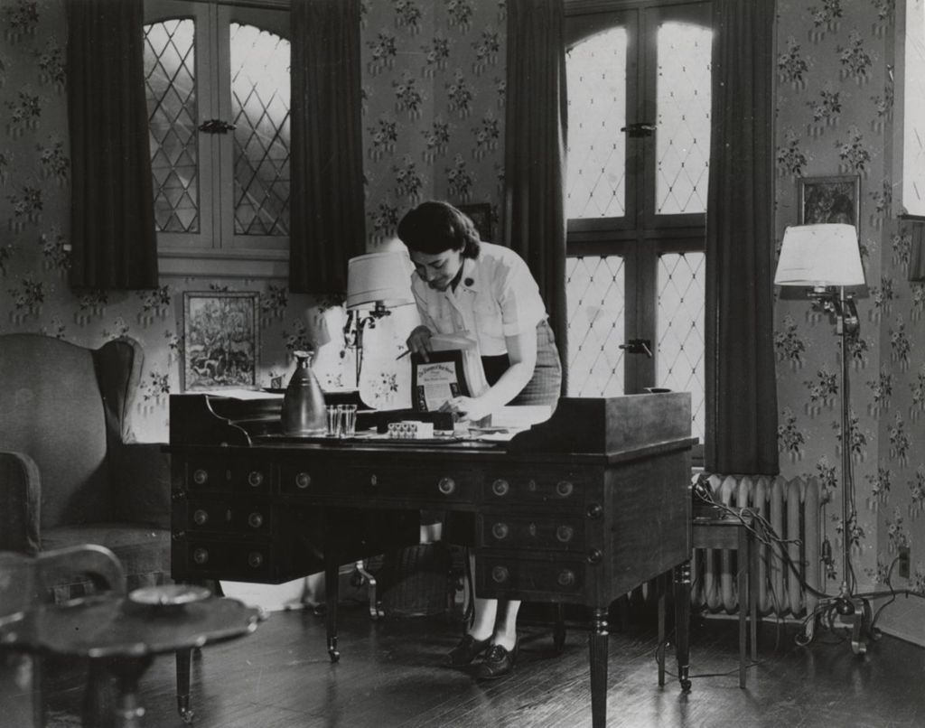 Miniature of Woman standing at desk at Hull-house