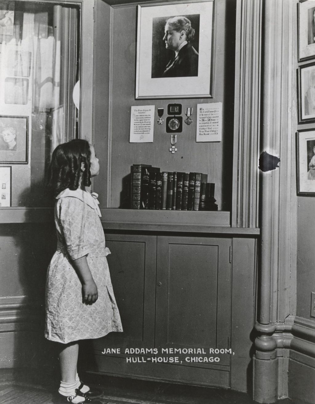 Miniature of Girl looking at Jane Addams memorabilia in Jane Addams Memorial Room (Octagon Room) in Hull-House