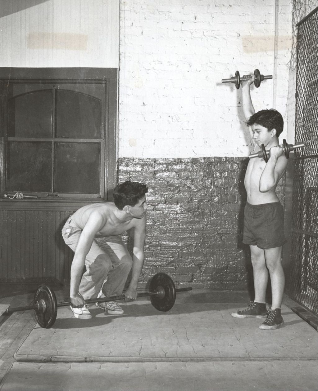 Boys lifting weights