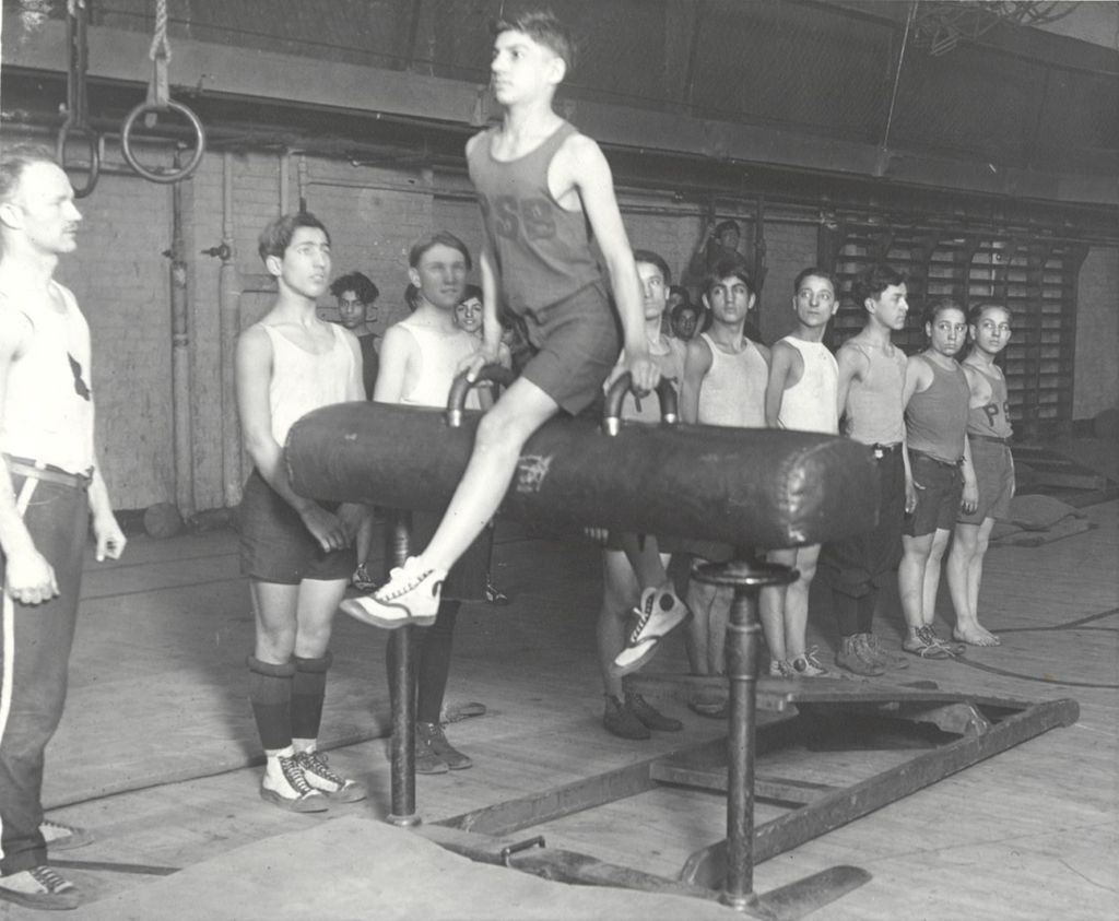 Young man on pommel horse in Hull-House gymnastics class