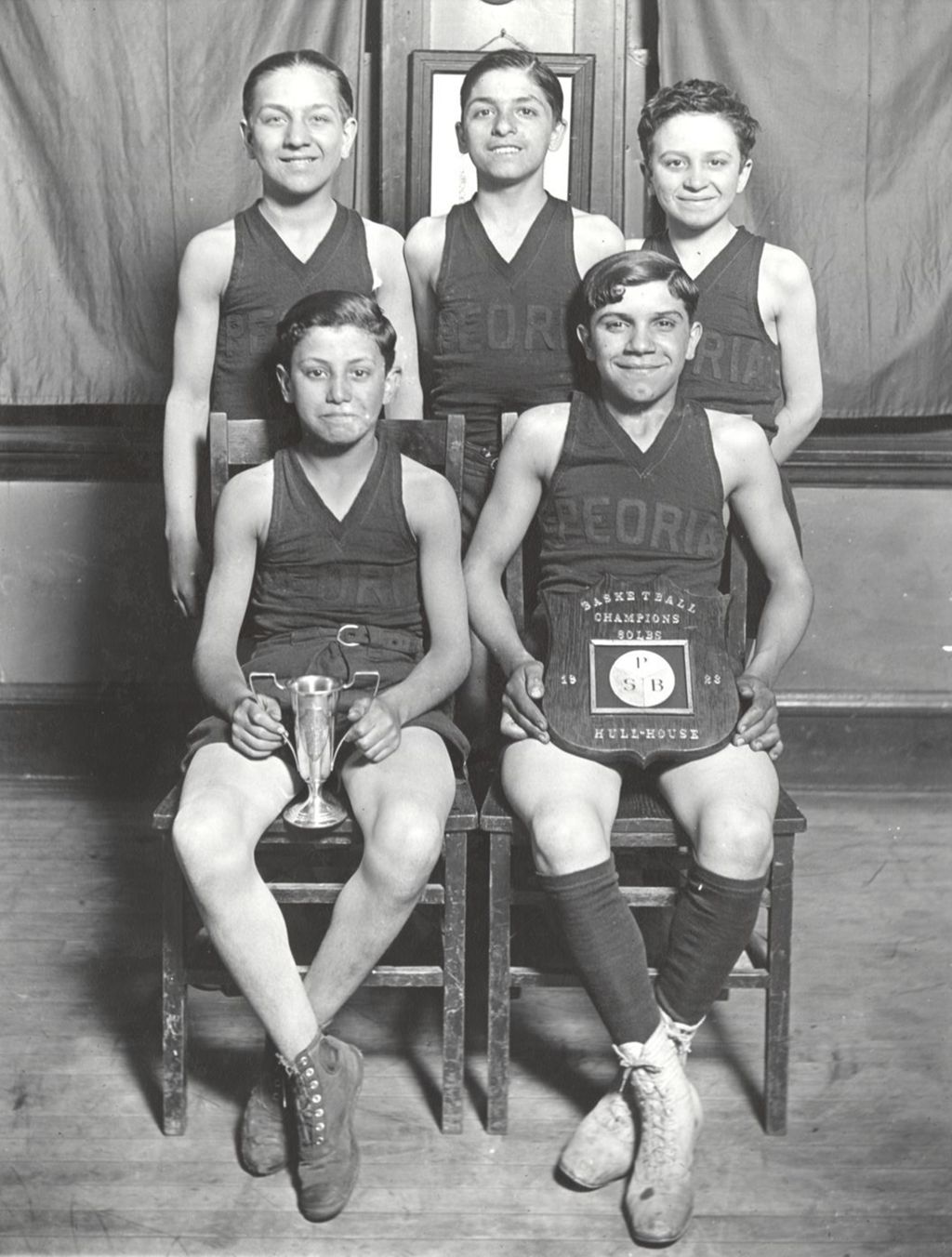 Miniature of Peoria Club basketball team with plaque and trophy
