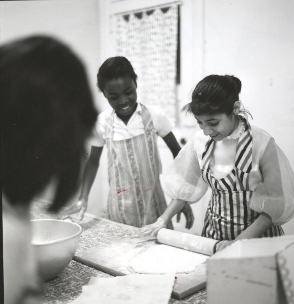 Girls working with dough in cooking class