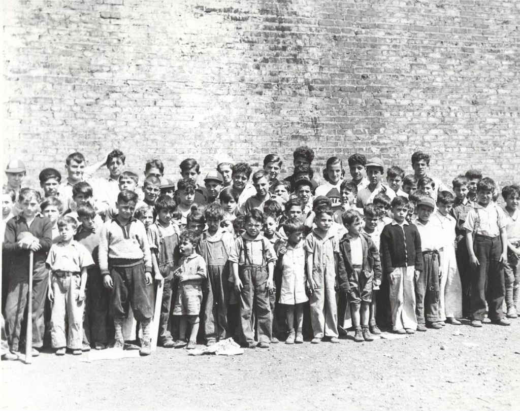 Miniature of Dozens of boys pose in front of a brick wall