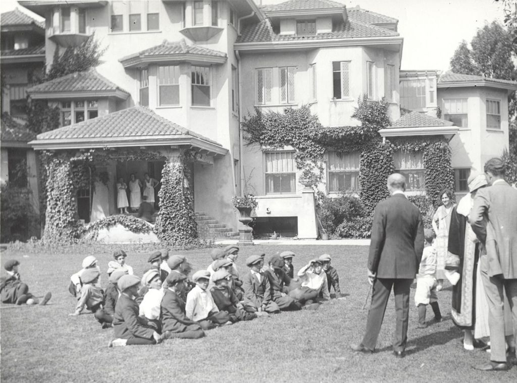 A group of boys sitting on the lawn at Pick Estate