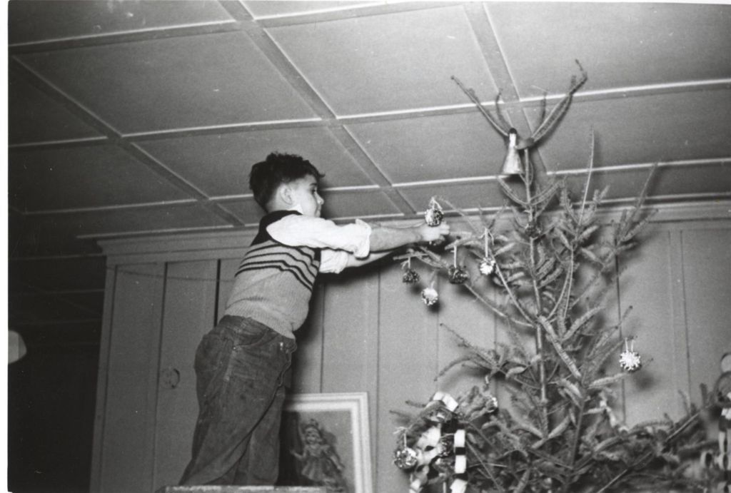Miniature of Boy decorating a Christmas tree