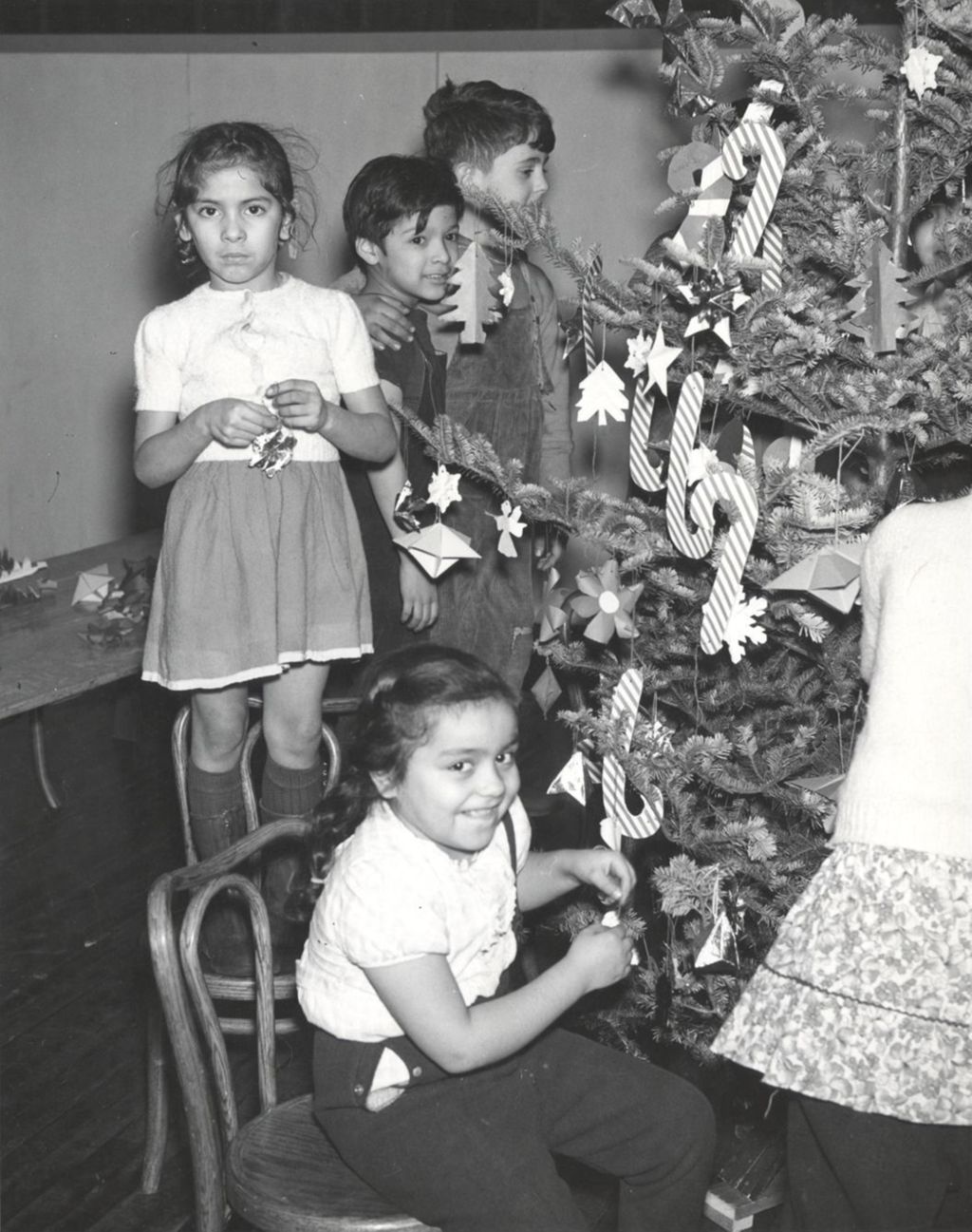 Miniature of Children decorating a Christmas tree