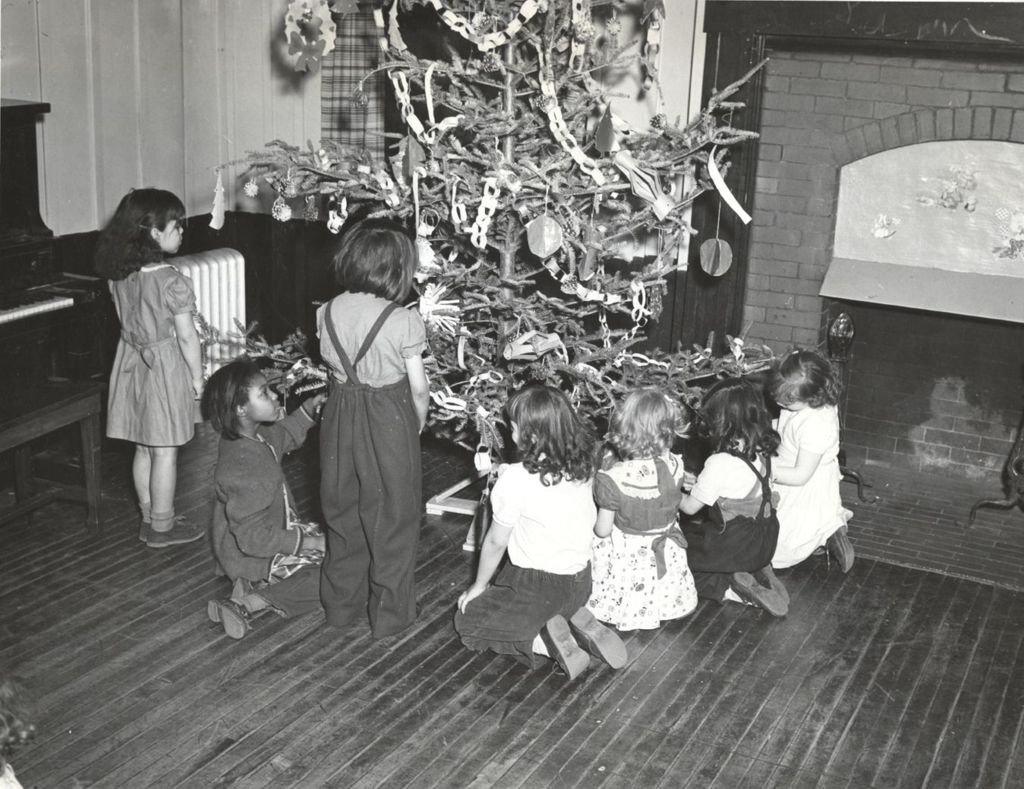 Girls decorating Christmas tree