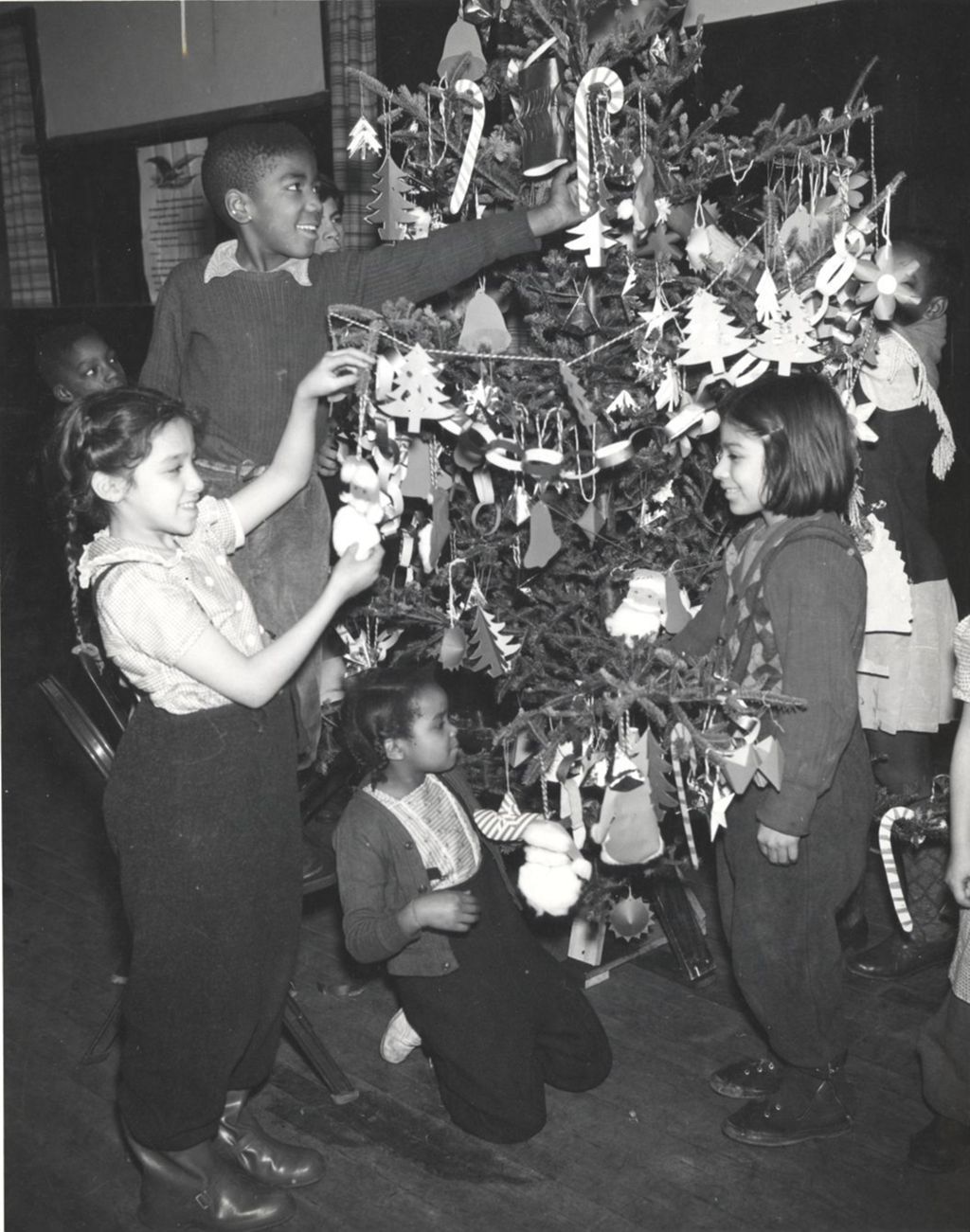 Miniature of Children trimming a Christmas tree