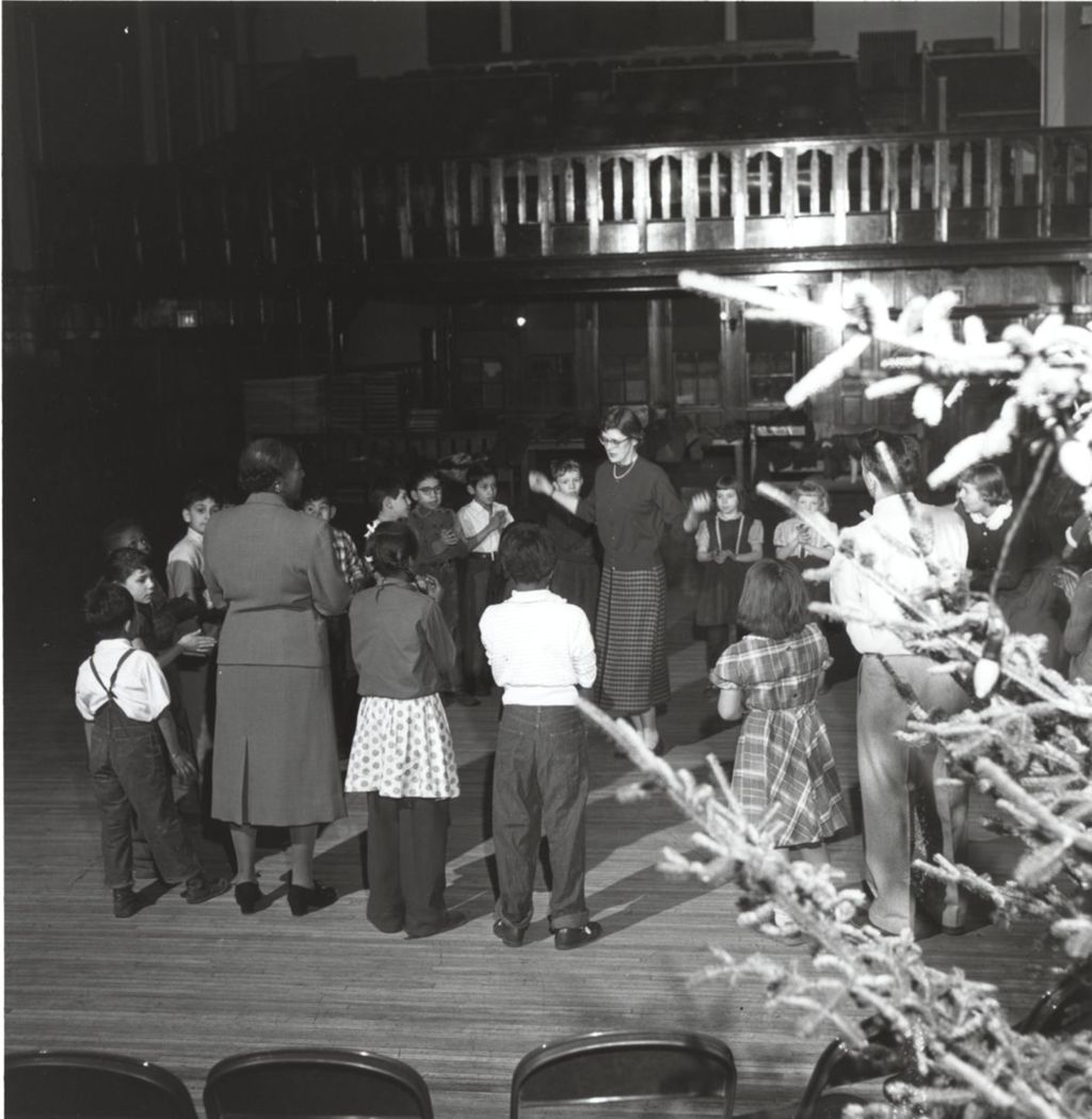 Miniature of Three adults with a group of children at a Hull-House Christmas event or rehearsal