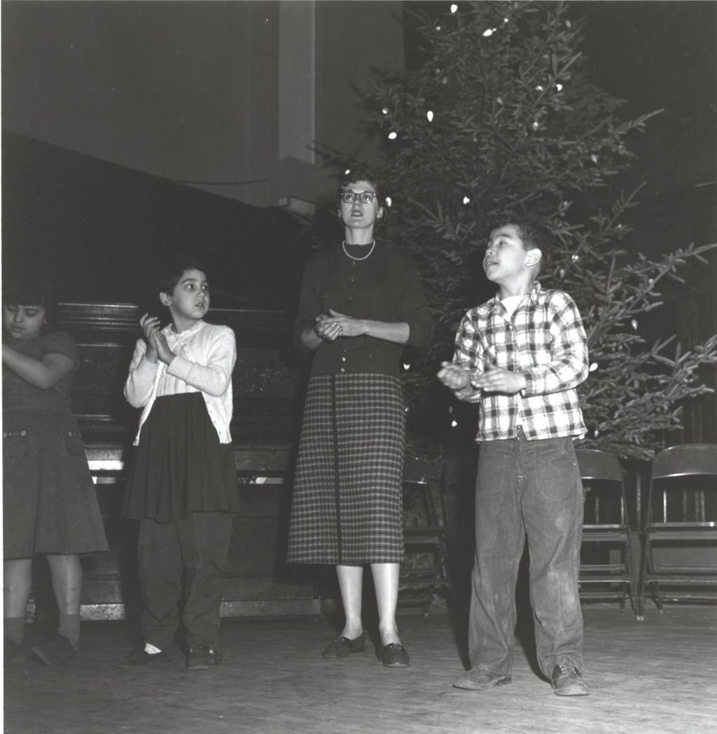 Miniature of A woman and three children at a Hull-House Christmas event or rehearsal