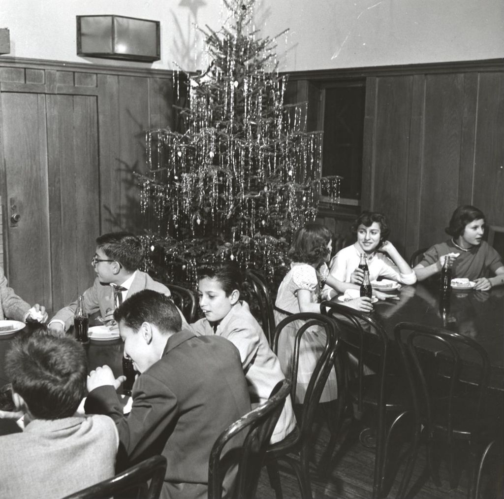 Teens eating at Hull-House Christmas party