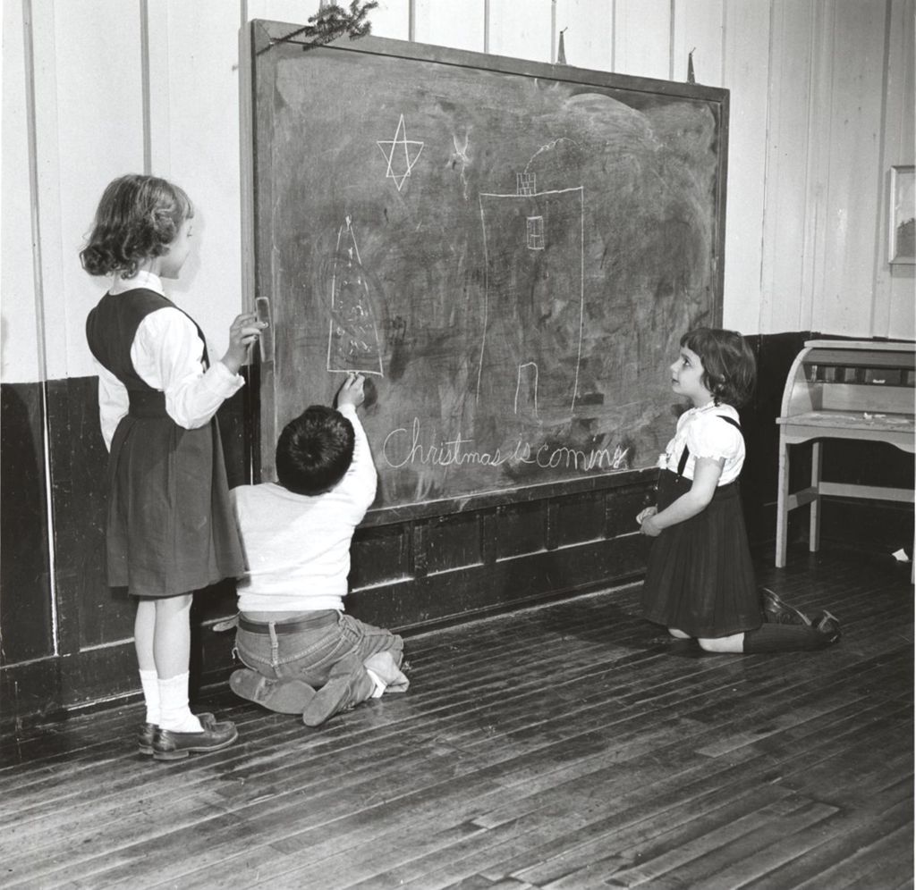 Children at a blackboard