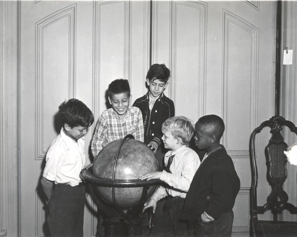 Miniature of Five boys standing around large globe