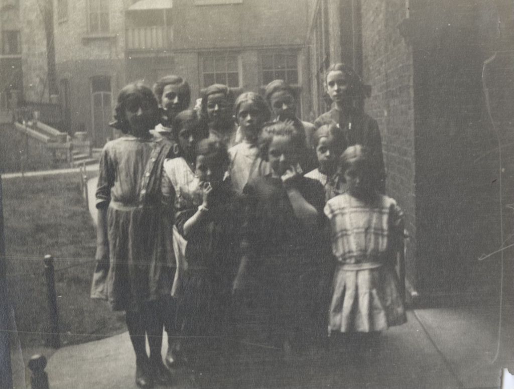 Miniature of Eight girls posing in Hull-House courtyard