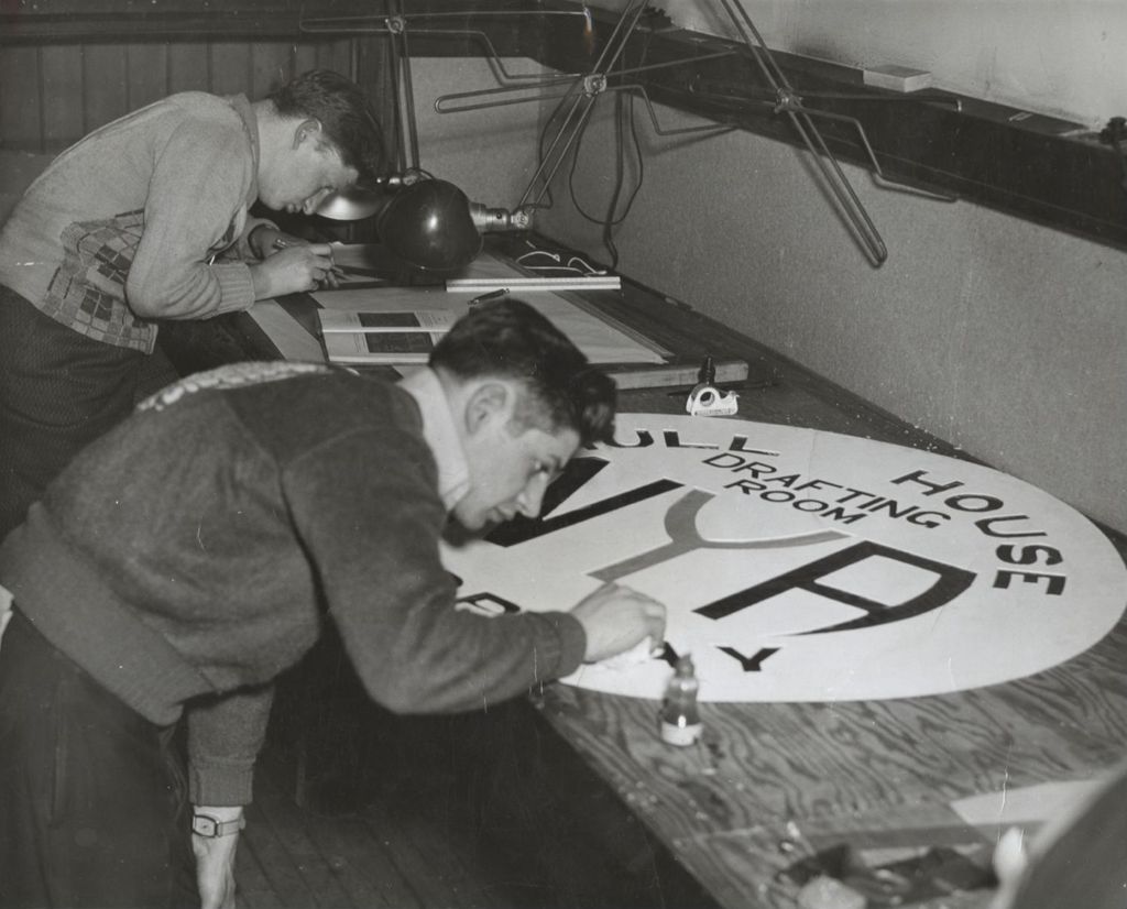 Young man finishing sign for 1941 National Youth Administration (N.Y.A.) exhibit