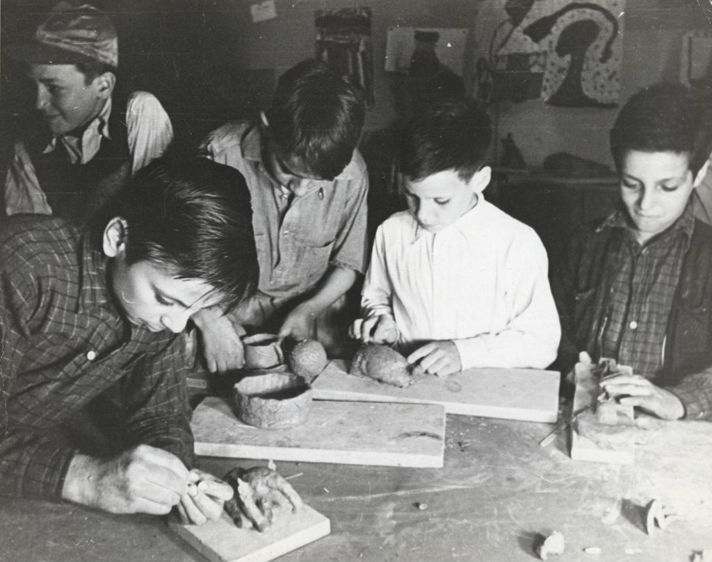 Miniature of Boys working with clay in ceramics class