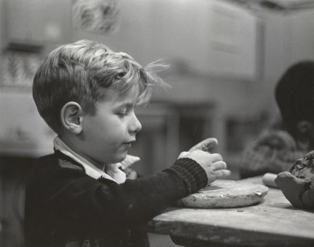 Miniature of Boy working with clay in ceramics class