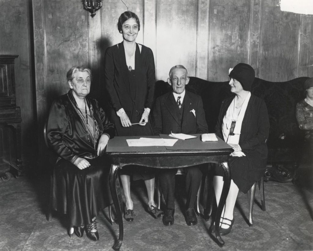 Miniature of Jane Addams and others at a meeting