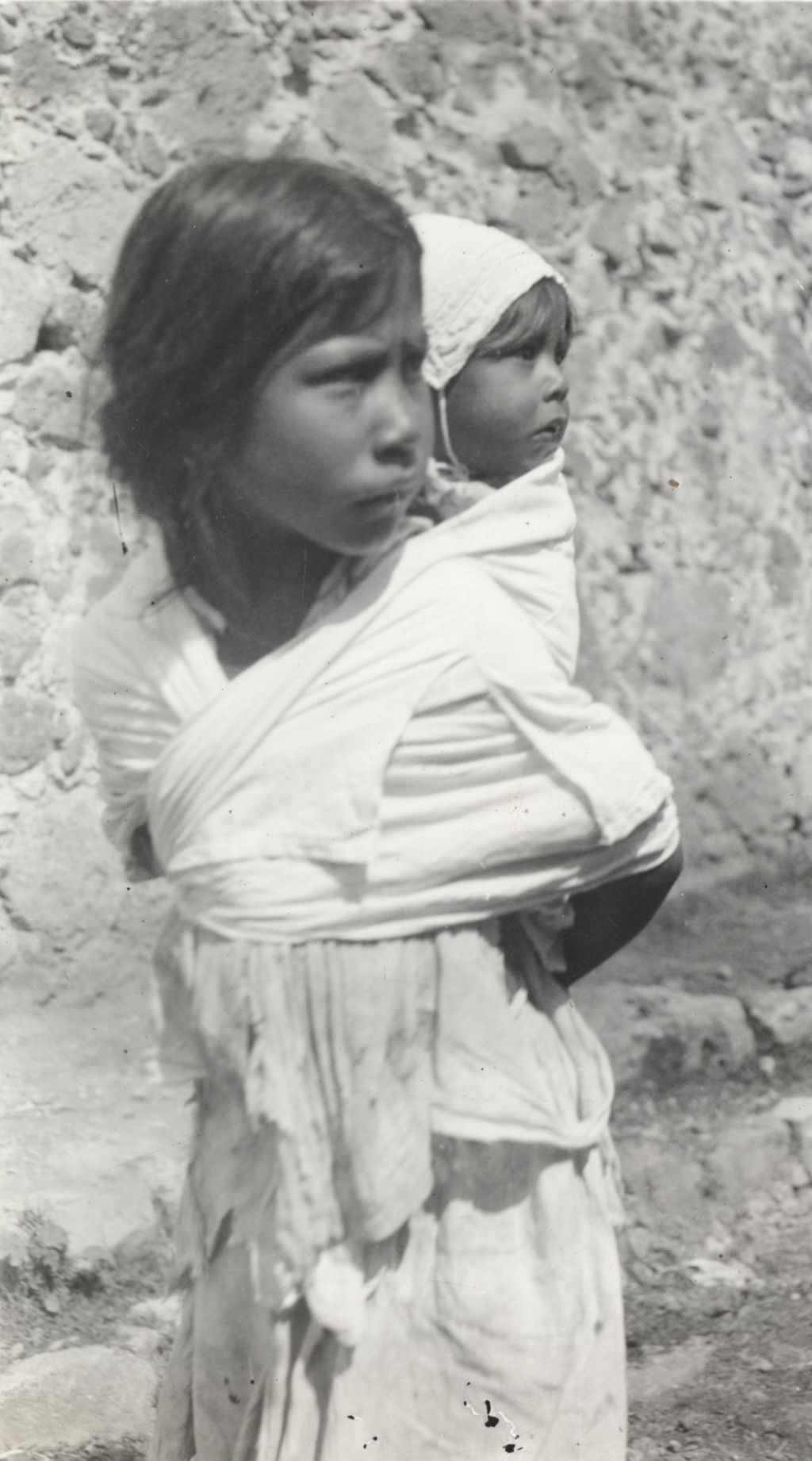 Small girl with infant photographed on Jane Addams' trip to Mexico
