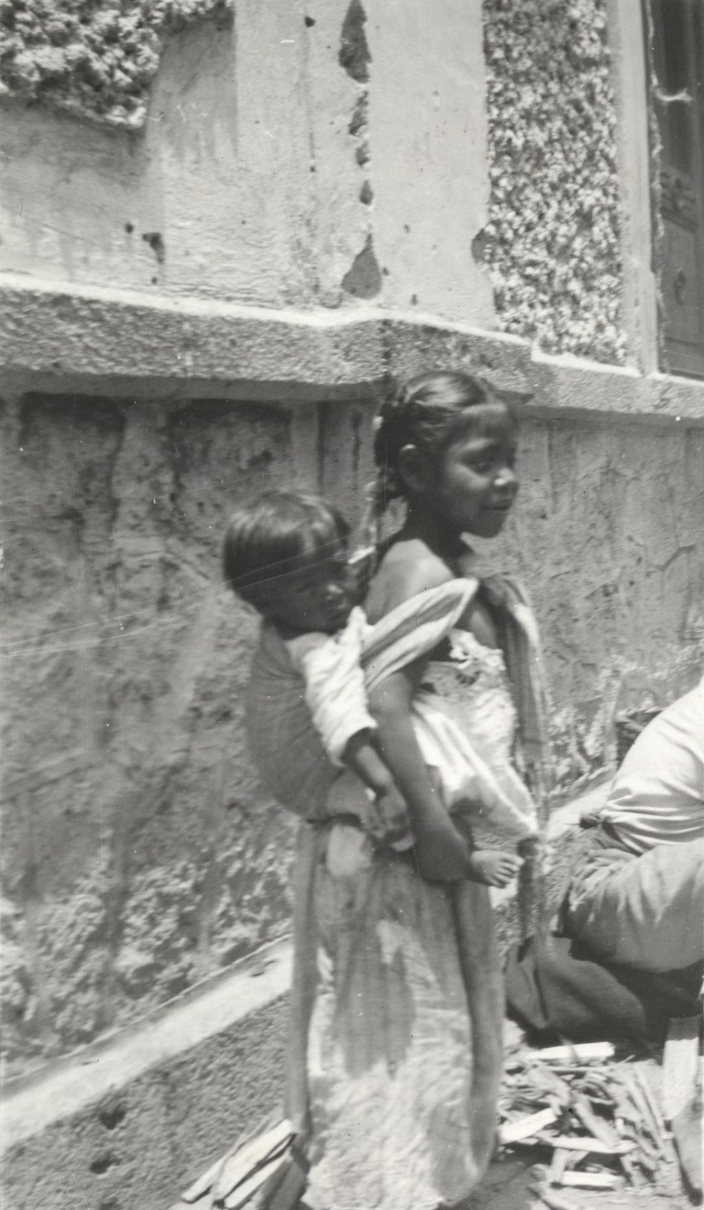 Young girl with child photographed during Jane Addams' trip to Mexico