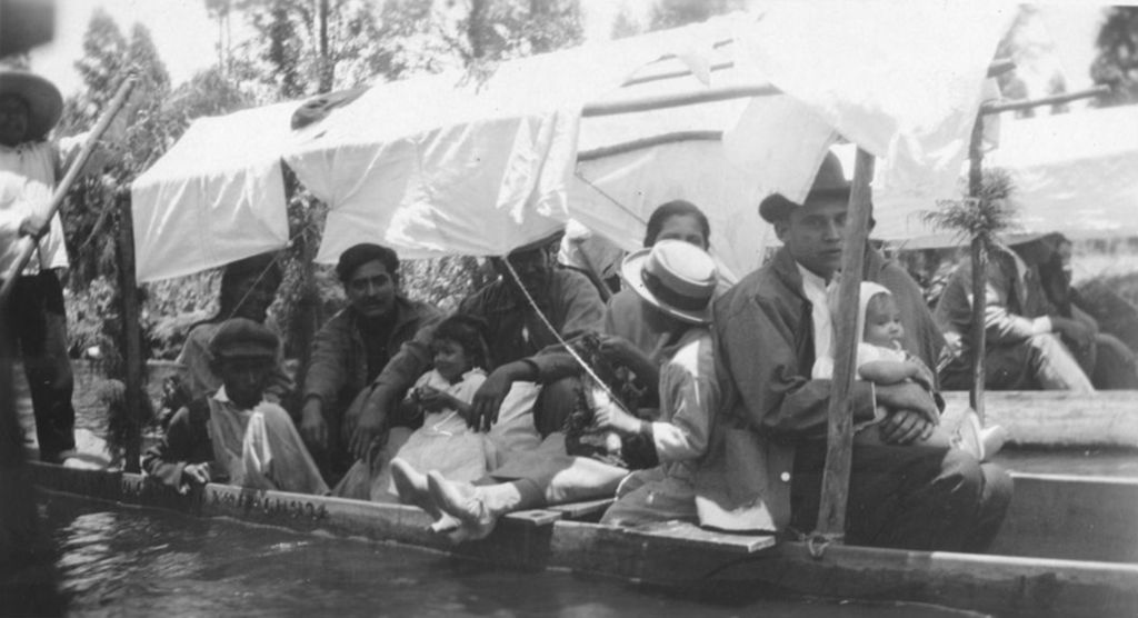Group of people in a covered boat photographed on Jane Addams' trip to Mexico