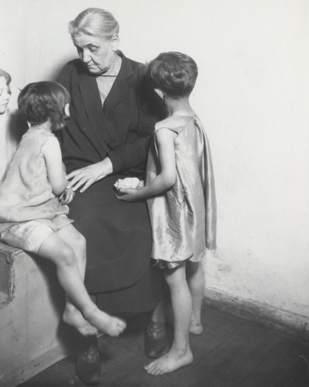 Jane Addams and Theater Children, One to Left and One Seated at Her Right