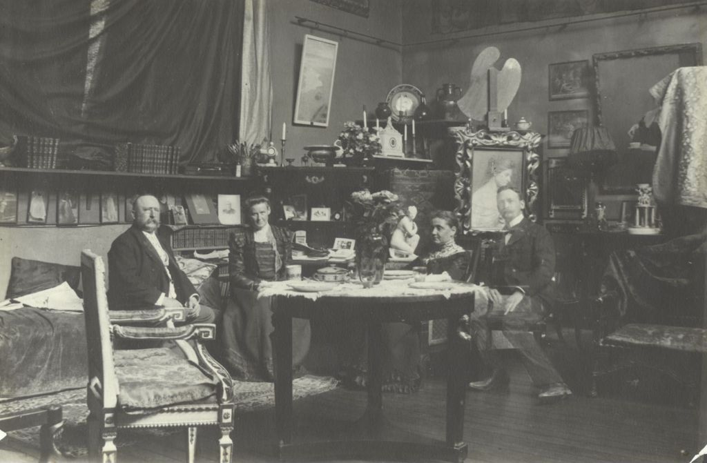Miniature of Jane Addams and others in an apartment