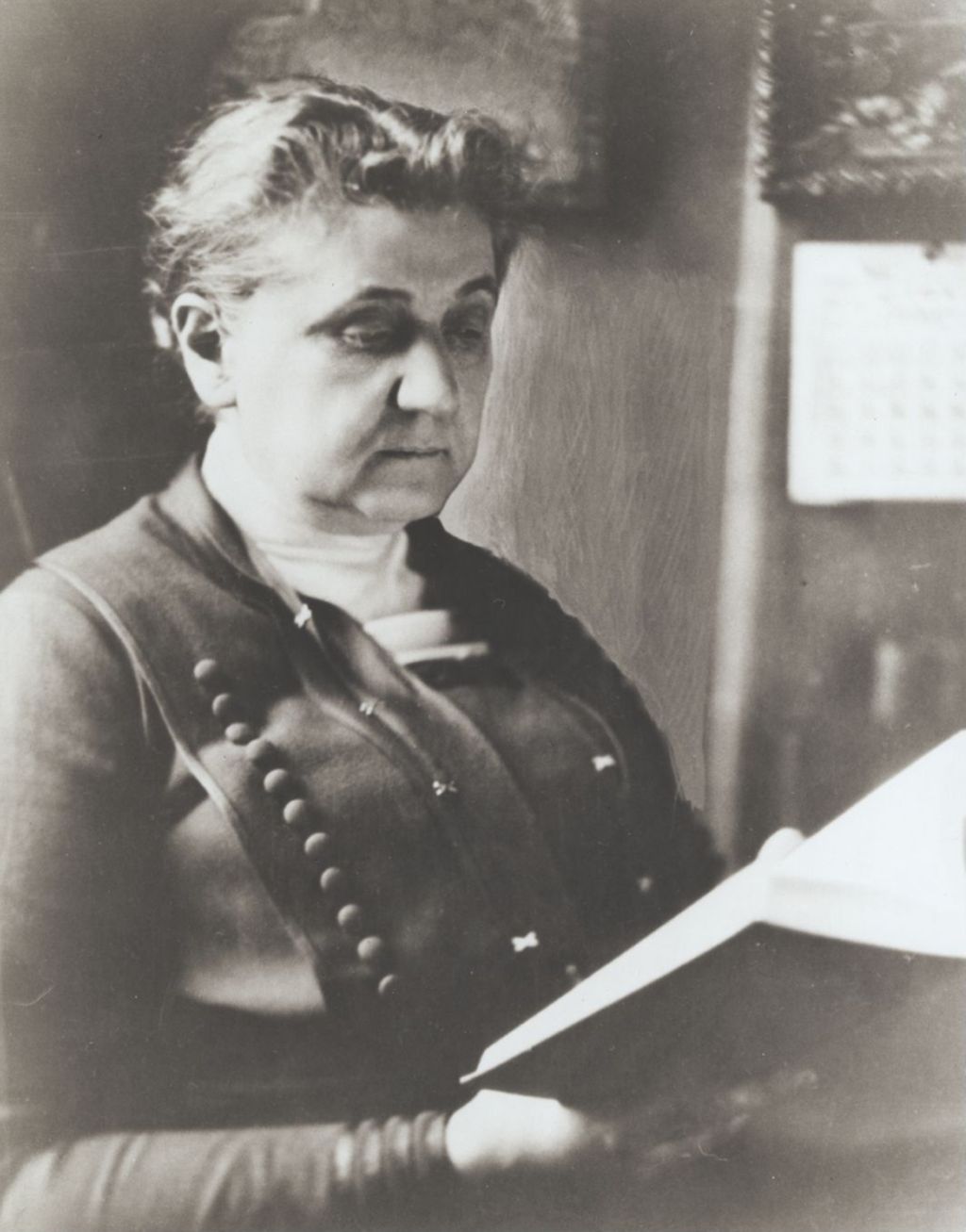 Miniature of Jane Addams reading a book