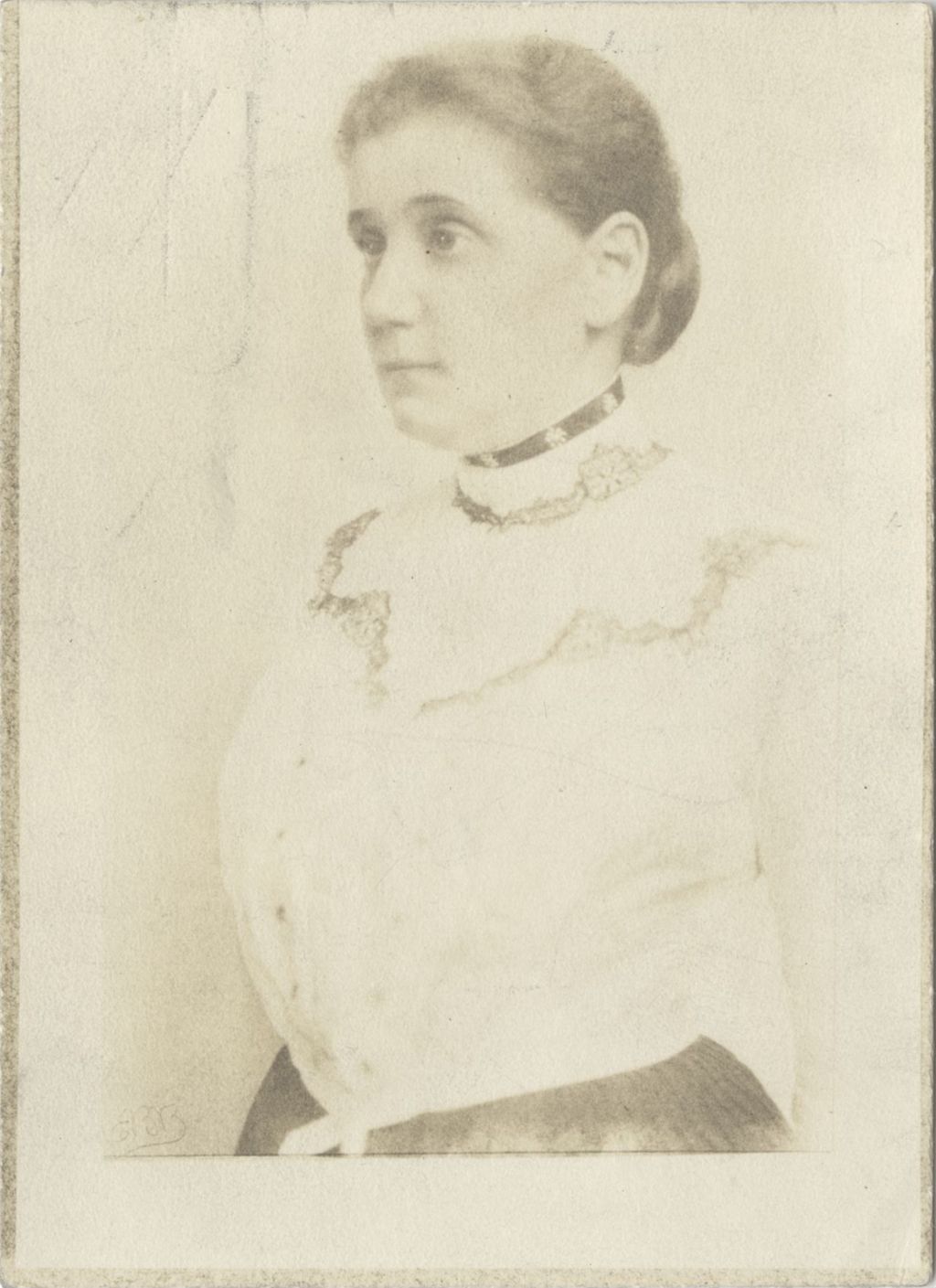 Waist-up 3/4 portrait of Jane Addams wearing a high-necked light colored blouse
