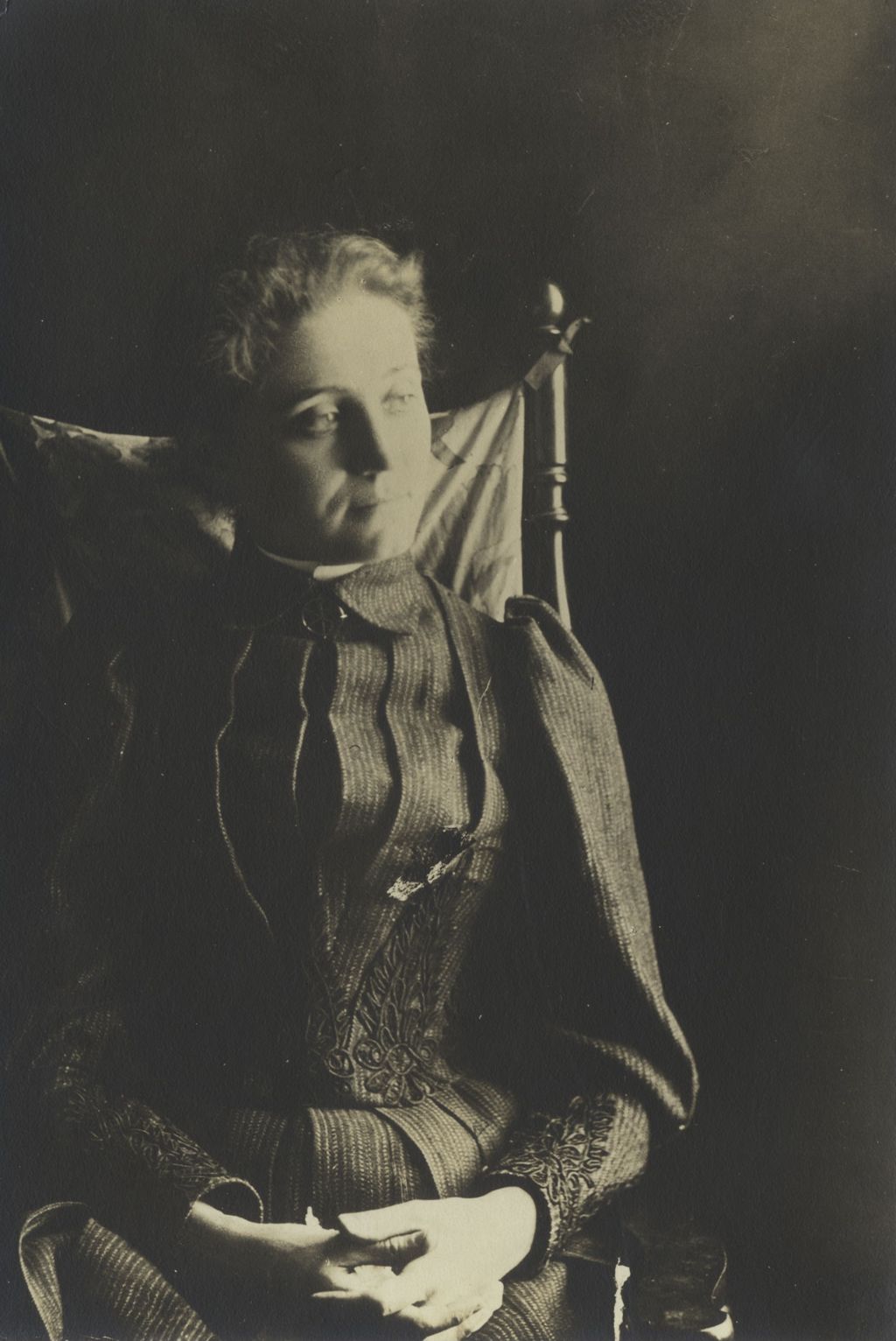 Portrait of Jane Addams seated in a rocking chair